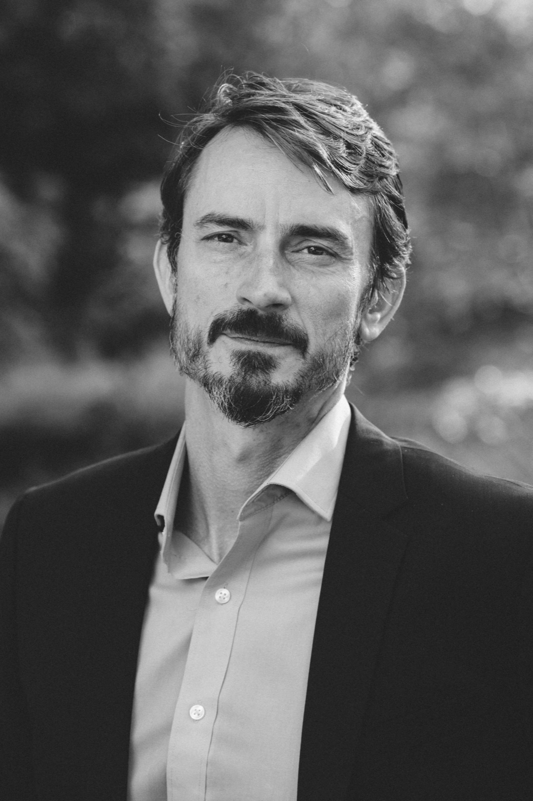 Luke Edwards headshot — direct gaze in a jacket